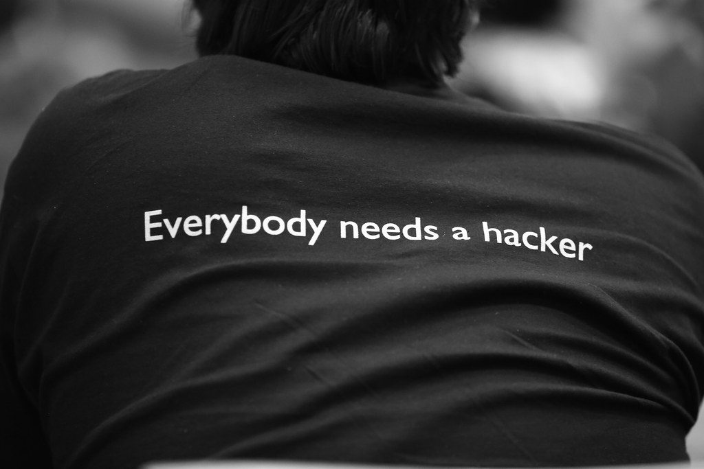 "Everybody needs a hacker" by Alexandre Dulaunoy (licensed under CC BY-SA 2.0)
