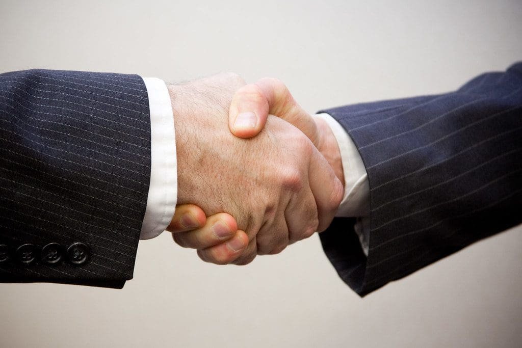 "Handshake - 2 men" by flazingo_photos (licensed under CC BY-SA 2.0)