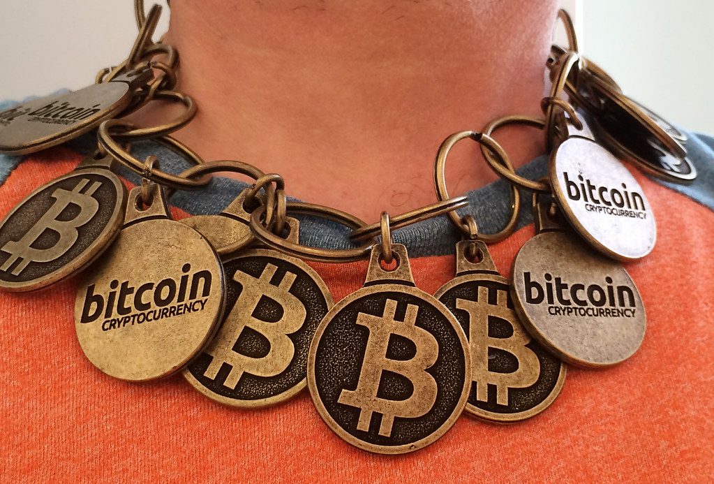 "Bitcoin 'Blockchain' Necklace" by btckeychain is licensed under CC BY 2.0