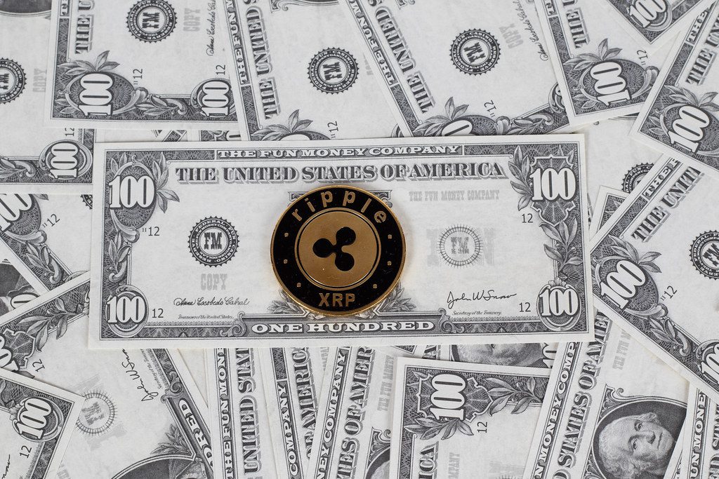 "Ripple coin on a paper dollars"