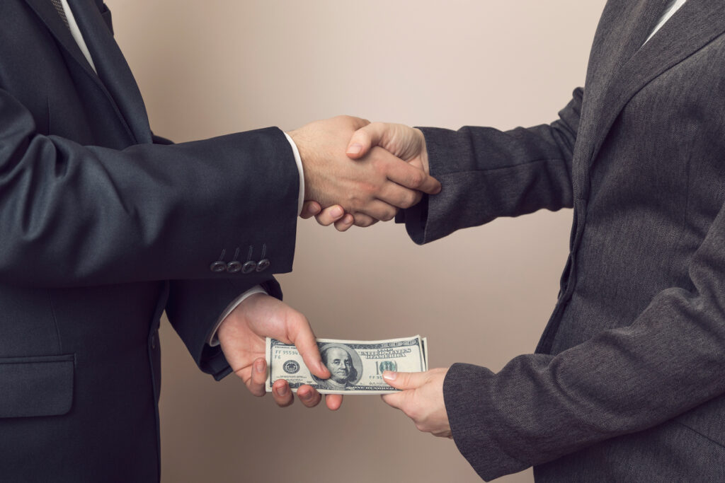 Image showing businessman paying bribe to a person