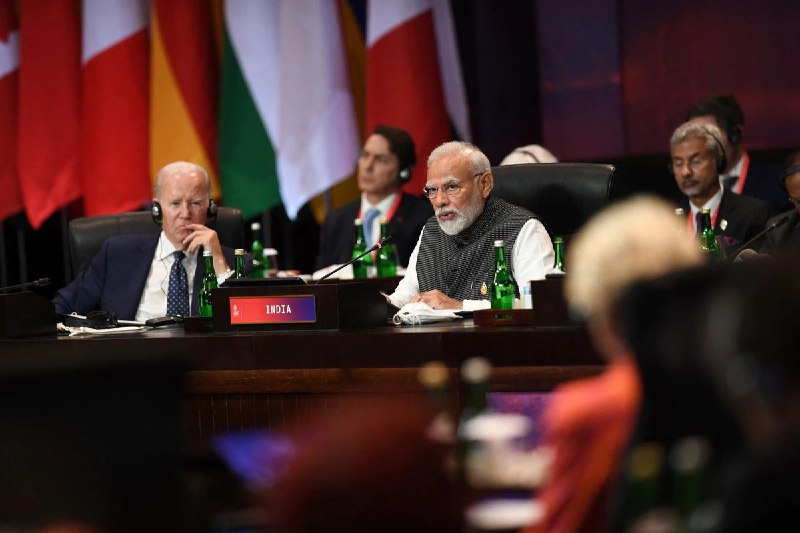 US President Joe Biden listens to Indian PM Narendra Modi during the G20 Summit opening.