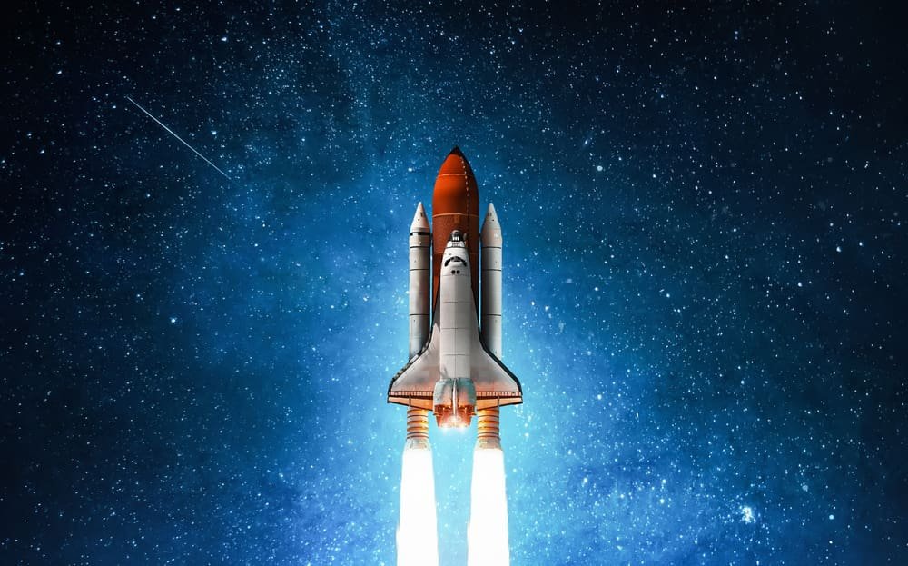 Spaceship in deep space. Starry sky and blue galactics. View on space shuttle and milky way. Elements of this image furnished by NASA