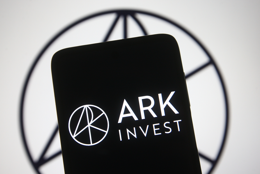 KYIV, UKRAINE - MARCH 21, 2021: In this photo illustration ARK Investment Management LLC logo of an American asset-management company is seen on a mobile phone and a computer screen.