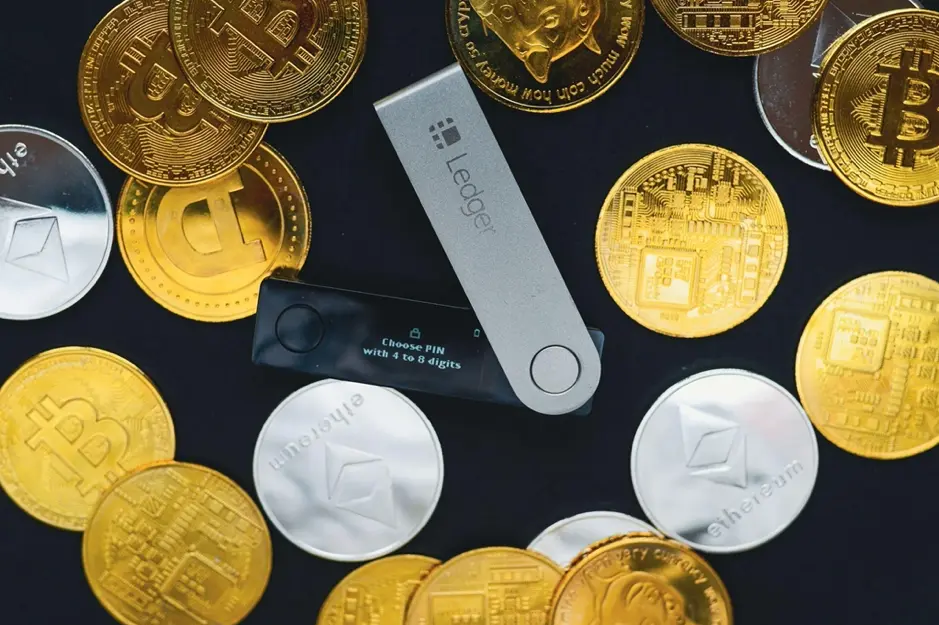 Crypto coins along with the Ledger crypto wallet