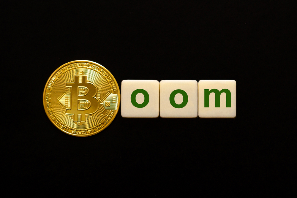 Word Boom made up of cubes. The first letter of the word is symbolized by a bitcoin coin. Concept of strong BTC, bitcoin growth rate, price increase, blockchain confidence, positive price outlook.
