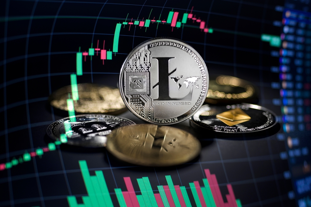 Litecoin cryptocurrency investing concept with graph. Bitcoin and Litecoin cryptocurrency coins symbol. Trading on the cryptocurrency exchange. Trends in lite coin and bitcoin exchange rates.